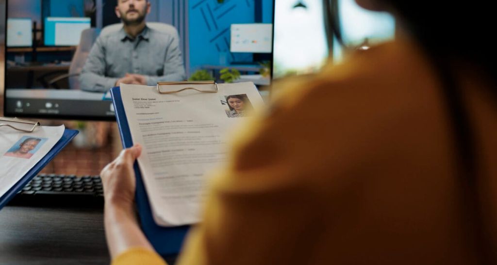 Businesswoman reading freelancer cv discussing hiring offer