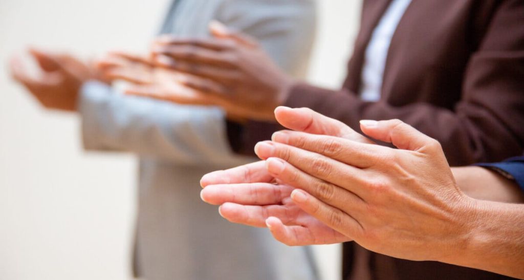 Hands of business people applauding speaker